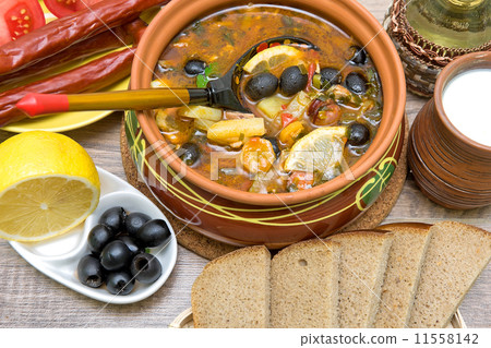 Russian thistle soup and other food on a wooden background Russian thistle soup and other food on a wooden background 11558142