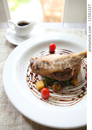Duck confit , Roasted duck with blueberry sauce Duck confit , Roasted duck with blueberry sauce 11561327