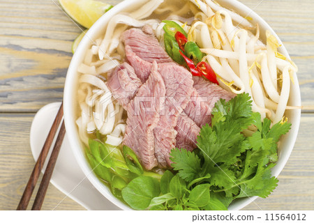 Pho Bo - Vietnamese rice noodle soup with beef, herbs and chili  11564012