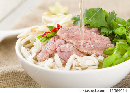 Pho Bo - Vietnamese rice noodle soup with beef, herbs and chili  11564014