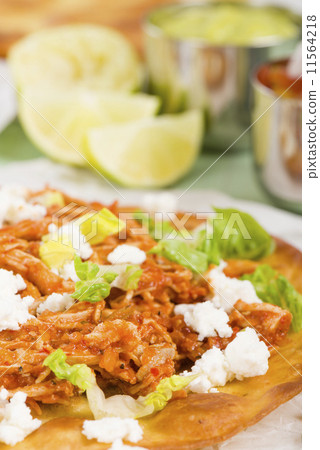 Tostadas - Mexican crispy tortilla with spicy chicken tinga  11564218