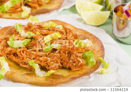Tostadas - Mexican crispy tortilla with spicy chicken tinga Tostadas - Mexican crispy tortilla with spicy chicken tinga 11564219