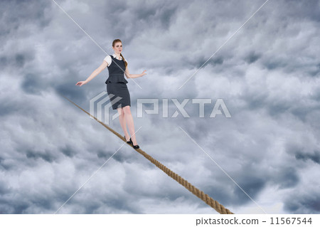 Composite image of woman looks straight ahead as she celebrates 11567544