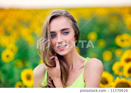 Woman with sunflowers Woman with sunflowers 11570616