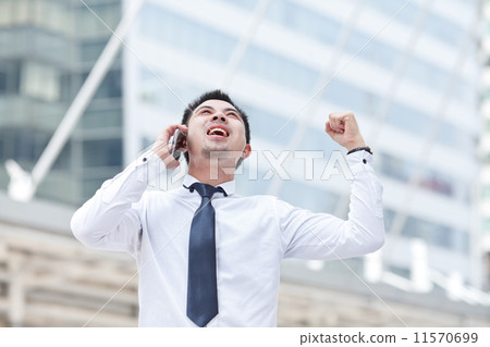 Asian business man speaking mobile phone Asian business man speaking mobile phone 11570699