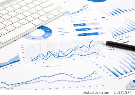 blue graph and chart reports on office table 11571574