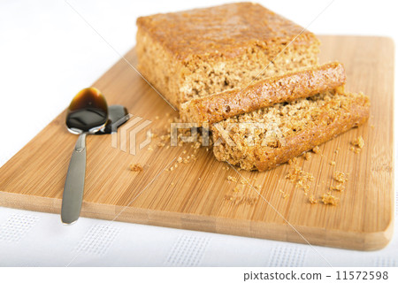 Parkin - Yorkshire parkin and black treacle on a bamboo board Parkin - Yorkshire parkin and black treacle on a bamboo board 11572598