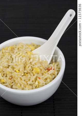 Oriental egg fried rice on a black mat Oriental egg fried rice on a black mat 11573636