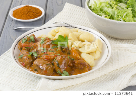 Goulash - Hungarian sausage stew with homemade nokedli & salad Goulash - Hungarian sausage stew with homemade nokedli & salad 11573641