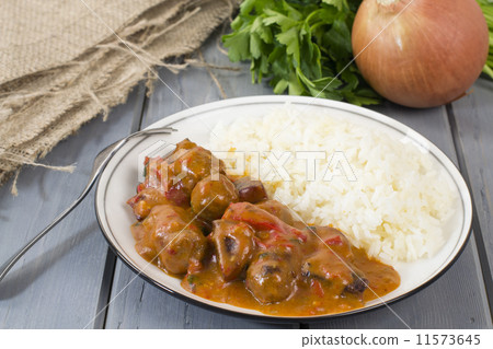 Goulash - Hungarian sausage stew served with white rice & salad Goulash - Hungarian sausage stew served with white rice & salad 11573645