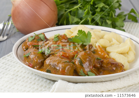 Goulash - Hungarian sausage stew served with homemade nokedli Goulash - Hungarian sausage stew served with homemade nokedli 11573646