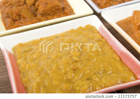 Thali - Indian vegetarian and meat curries, rice and bhajis Thali - Indian vegetarian and meat curries, rice and bhajis 11573757