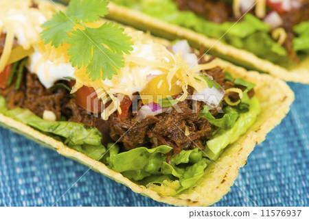 Shredded beef taco trays with salsa, sour cream and cheese Shredded beef taco trays with salsa, sour cream and cheese 11576937