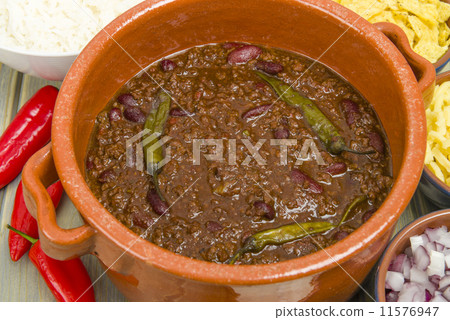 Chili Con Carne with onions, cheese, rice, sour cream & chips Chili Con Carne with onions, cheese, rice, sour cream & chips 11576947