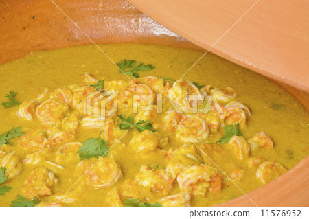 Moqueca de Camarao - Brazilian prawns in coconut milk and dende oil in a clay pan. Food from Bahia Moqueca de Camarao - Brazilian prawns in coconut milk and dende oil in a clay pan. Food from Bahia 11576952