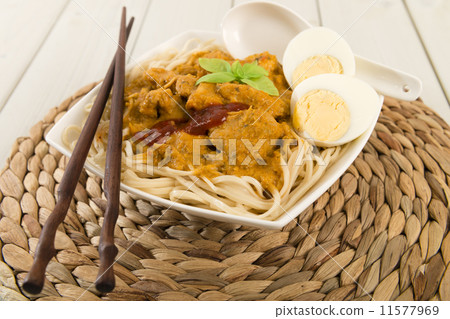 Dry Curry Mee - Malaysian chicken curry on noodles. Egg & sambal Dry Curry Mee - Malaysian chicken curry on noodles. Egg & sambal 11577969