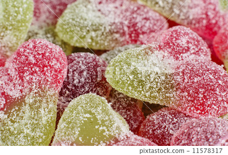 Sour Cherry Sweets - Close up of fizzy cherry flavoured gums. 11578317