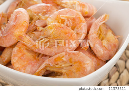 Sauteed Shrimp - Bowl of prawns, shell and tails on.  11578811