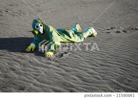 Man in gas masks crawling on poisoned soil 11580861