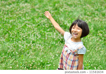 Girls playing on the lawn open space 11581634