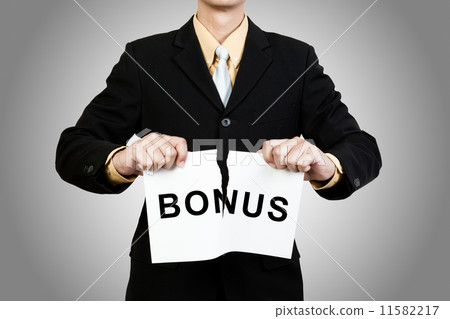 Businessman tear paper with word Bonus 11582217