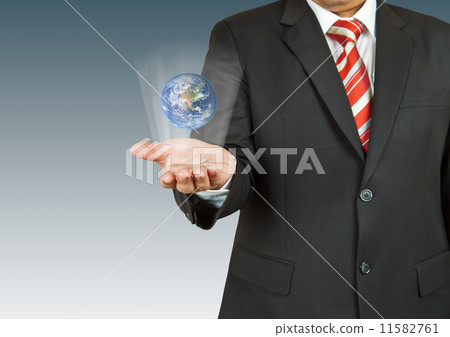 Businessman with earth in his hand. The Earth texture of this im 11582761