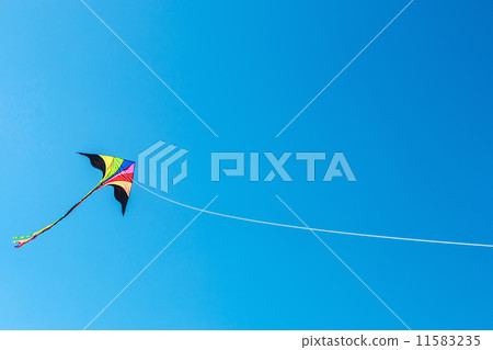 kite with tail in clear blue sky kite with tail in clear blue sky 11583235