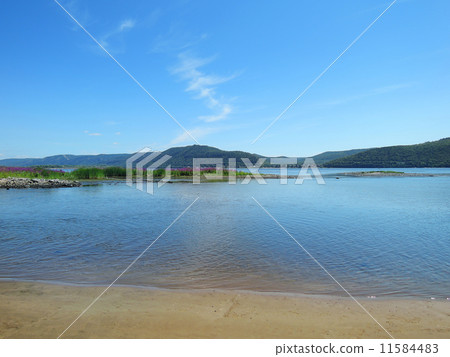 sandy beach overlooking the Volga Zhiguli Mountains 11584483