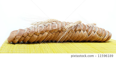 Fresh bread on a bamboo napkin. Fresh bread on a bamboo napkin. 11596189