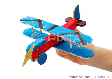 Children's creativity. The hand of the child with a wooden hand- Children's creativity. The hand of the child with a wooden hand- 11596194