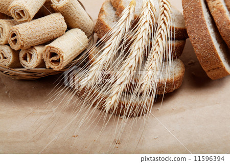 Fresh bread isolated on a light brown background. Fresh bread isolated on a light brown background. 11596394