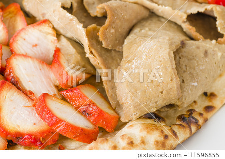 Chicken Tikka & Donner Meat on a naan bread.  Chicken Tikka & Donner Meat on a naan bread.  11596855