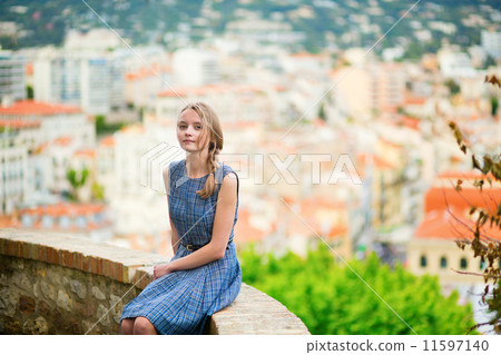 Elegant young woman in the Old town of Cannes 11597140