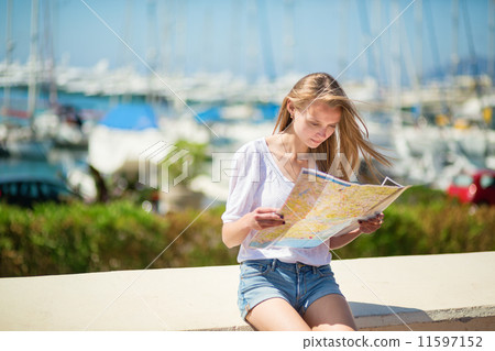 Girl looking for direction in Cannes, France 11597152