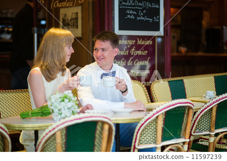 Just married couple drinking coffee in a cafe 11597239