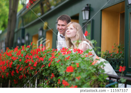 Happy young newly-wed couple on a balcony Happy young newly-wed couple on a balcony 11597337