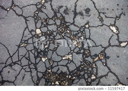 Cracked asphalt surface Cracked asphalt surface 11597417