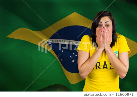 Composite image of nervous football fan in brasil tshirt Composite image of nervous football fan in brasil tshirt 11600971