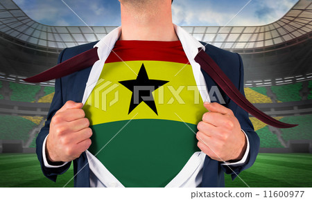 Composite image of businessman opening shirt to reveal ghana fla Composite image of businessman opening shirt to reveal ghana fla 11600977