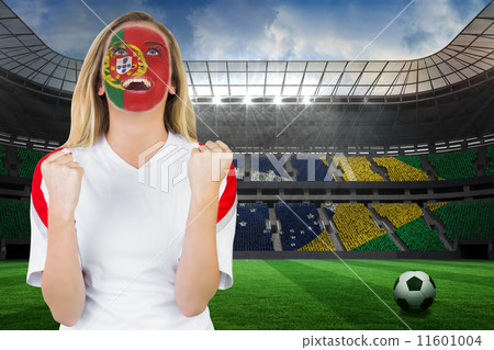 Composite image of excited portugal fan in face paint cheering Composite image of excited portugal fan in face paint cheering 11601004