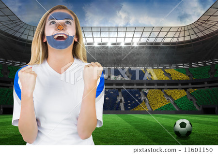 Composite image of excited argentina fan in face paint cheering Composite image of excited argentina fan in face paint cheering 11601150