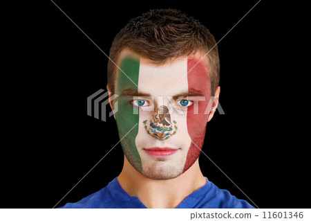 Composite image of serious young mexico fan with facepaint Composite image of serious young mexico fan with facepaint 11601346