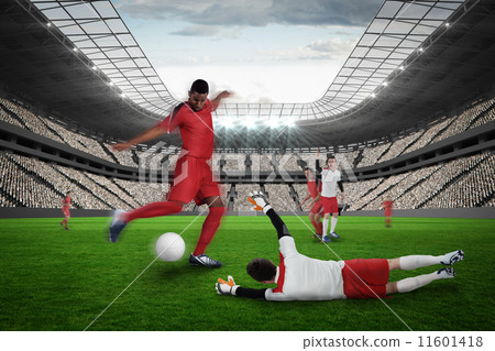 Football player in red kicking Football player in red kicking 11601418