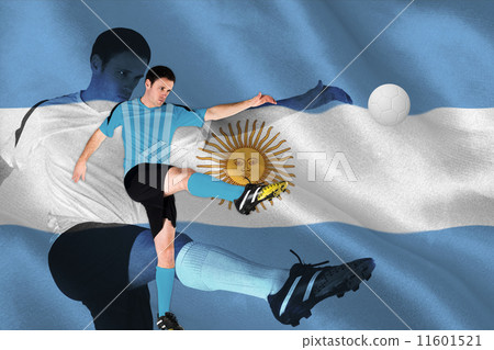 Composite image of football player in blue kicking 11601521