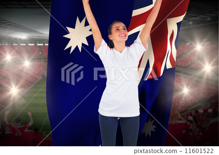 Composite image of excited football fan in white cheering holdin Composite image of excited football fan in white cheering holdin 11601522