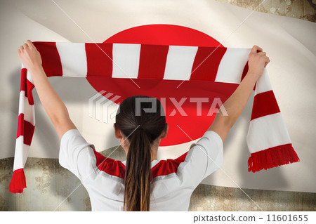 Composite image of football fan waving red and white scarf Composite image of football fan waving red and white scarf 11601655