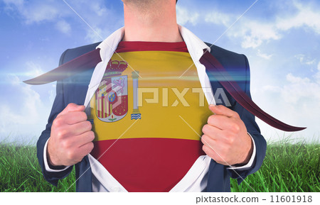 Composite image of businessman opening shirt to reveal spain fla 11601918