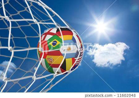 Composite image of football in multi national colours at back of 11602048