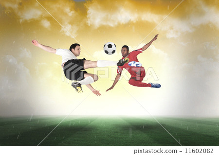 Composite image of football players tackling for the ball 11602082