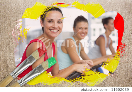 Composite image of spinning class in the gym 11602089